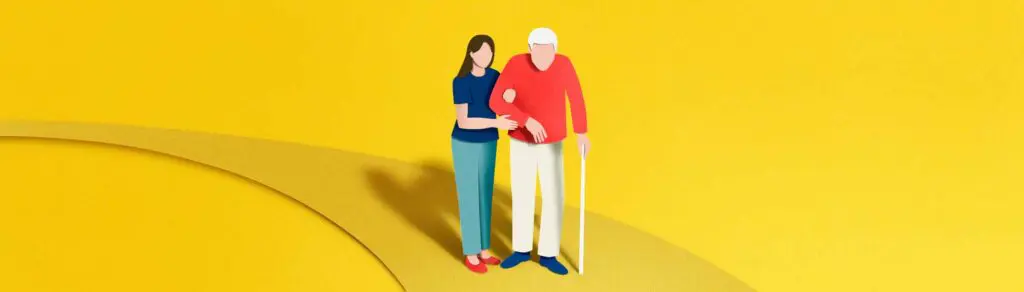 pflegende Angehörige stützt älteren Mann am Gehstock